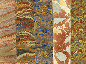 an assortment of five marbled papers