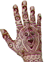 photo of the back of a hand covered with mehndi drawings